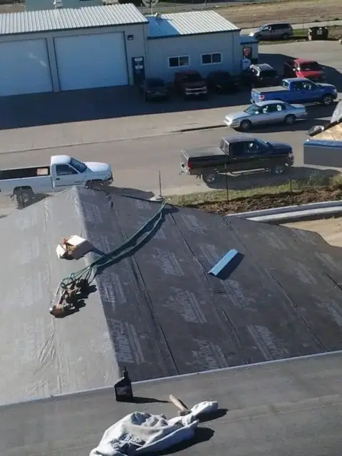 Low-slope roof tear-off with new underlayment going down
